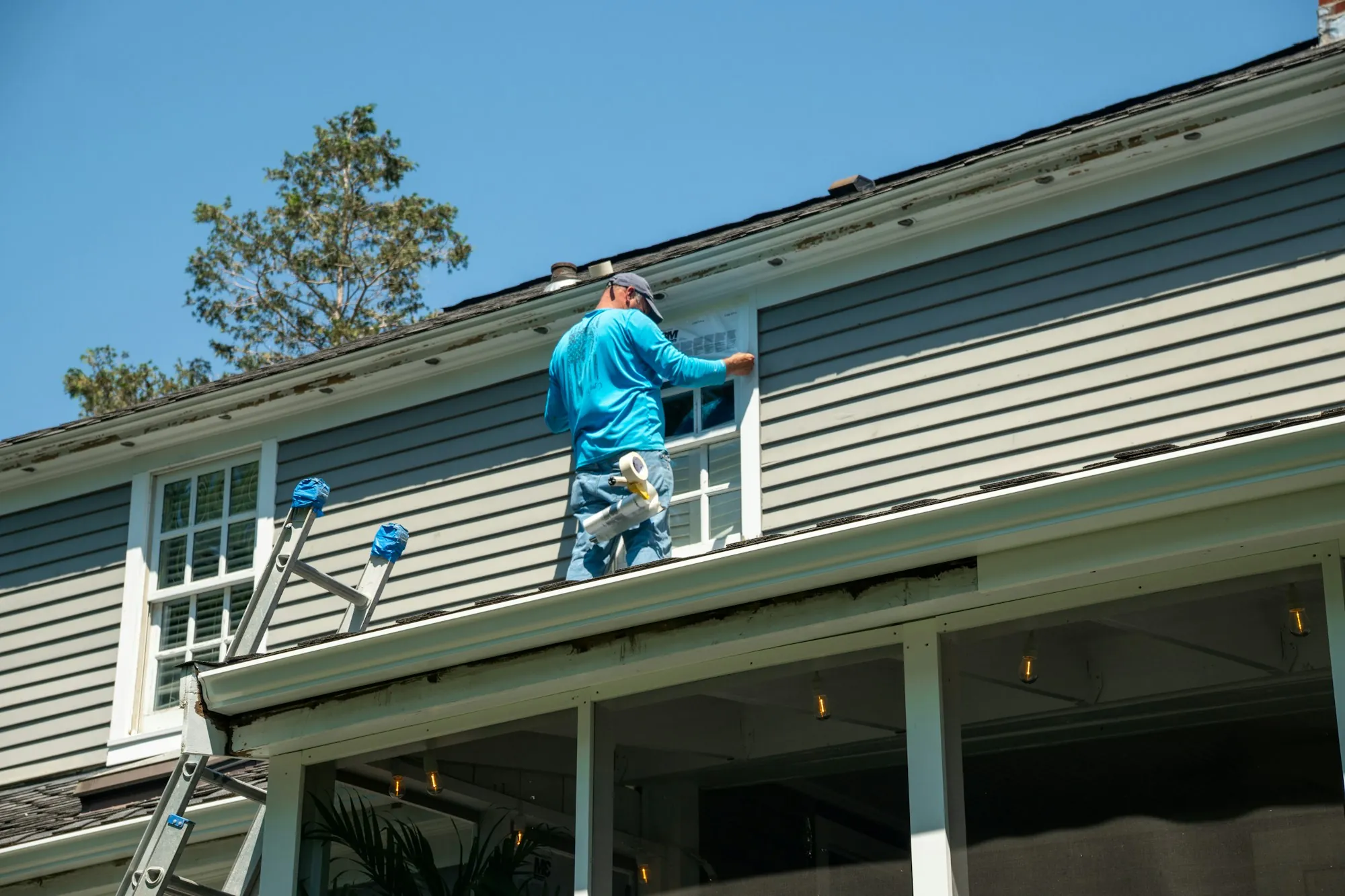 A roof with shingles removed and decking exposed